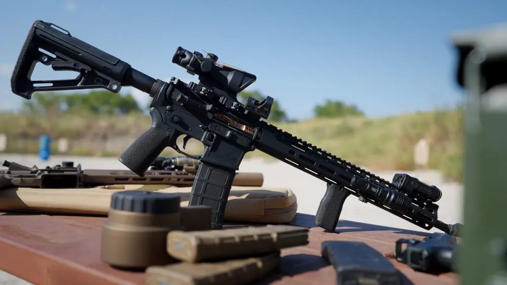 Shadow Systems U526 rifle with red dot and light, on the range table
