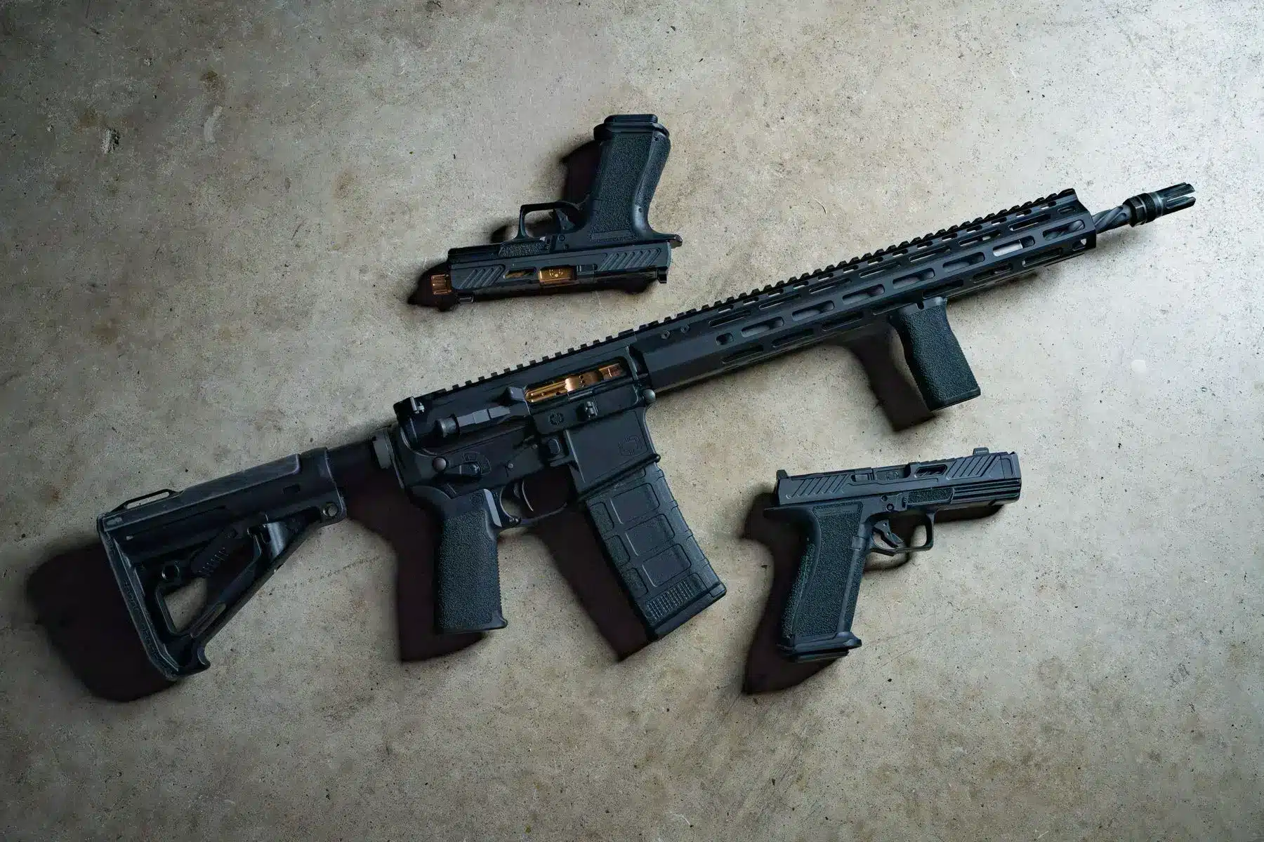 Shadow Systems U526 rifle with two E526 pistols, overhead flat lay
